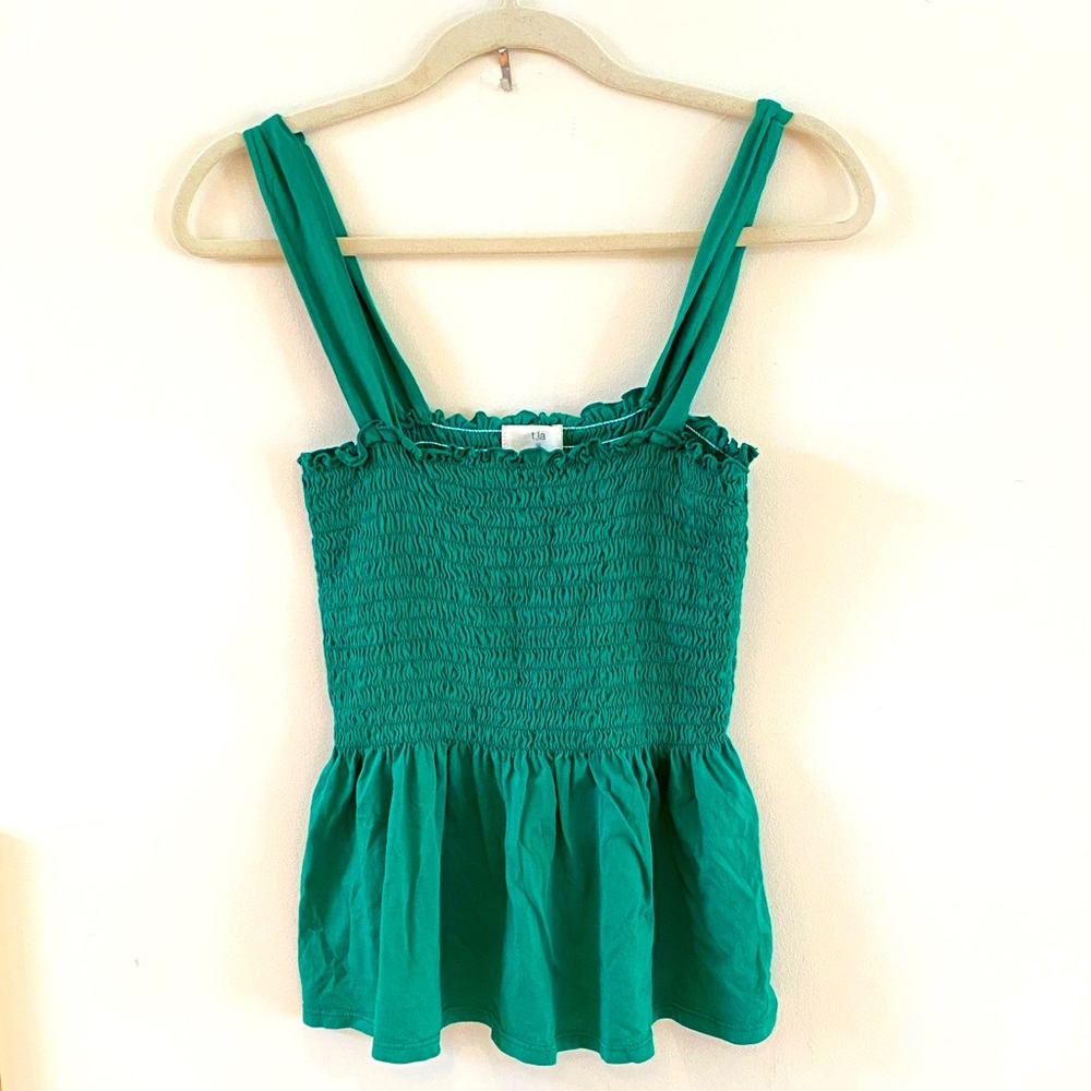 Peplum smocked top by t.la from Anthropologie. Color is emerald green. EUC.